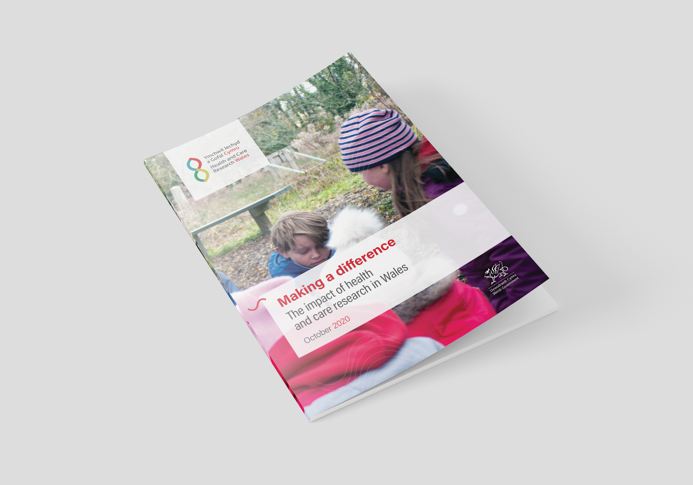 Cover of a report titled 'Making a difference: The impact of health and care research in Wales, October 2020' featuring a photo of a child and adult examining nature, with the Health and Care Research Wales logo in the corner.
