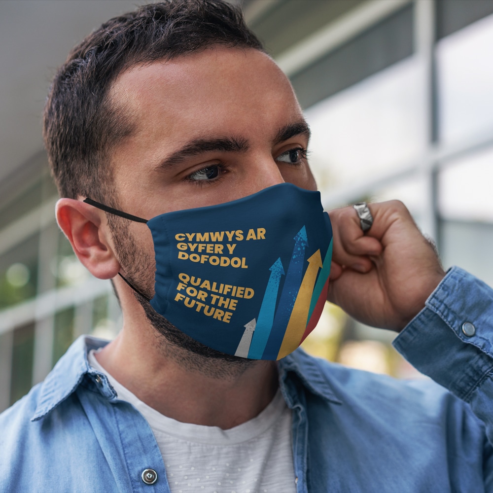 Man wearing Qualified for the Future branded face mask.